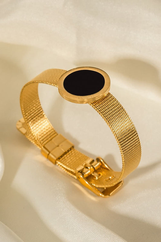 Gold Buckle Bracelet With A Black Disc